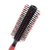 Woman Blow Drying Hair Brush