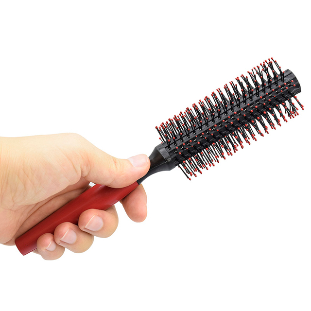 Woman Blow Drying Hair Brush