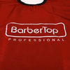 Black trimmed edge of red professional hairdressing cover